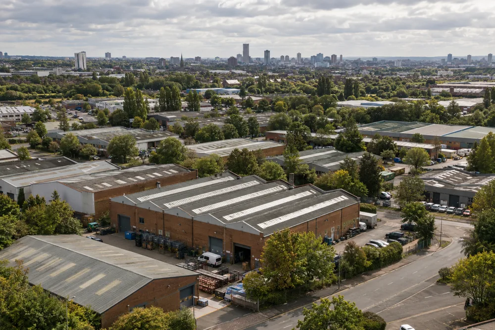 Industrial buildings and access roads in a West Midlands setting